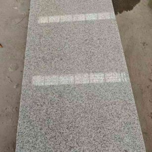 抚顺芝麻白光面毛板